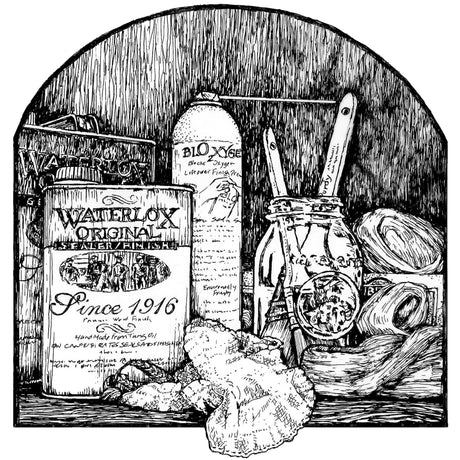 Wood finishing supplies and wood finishing book on a workbench beside a chair being finished